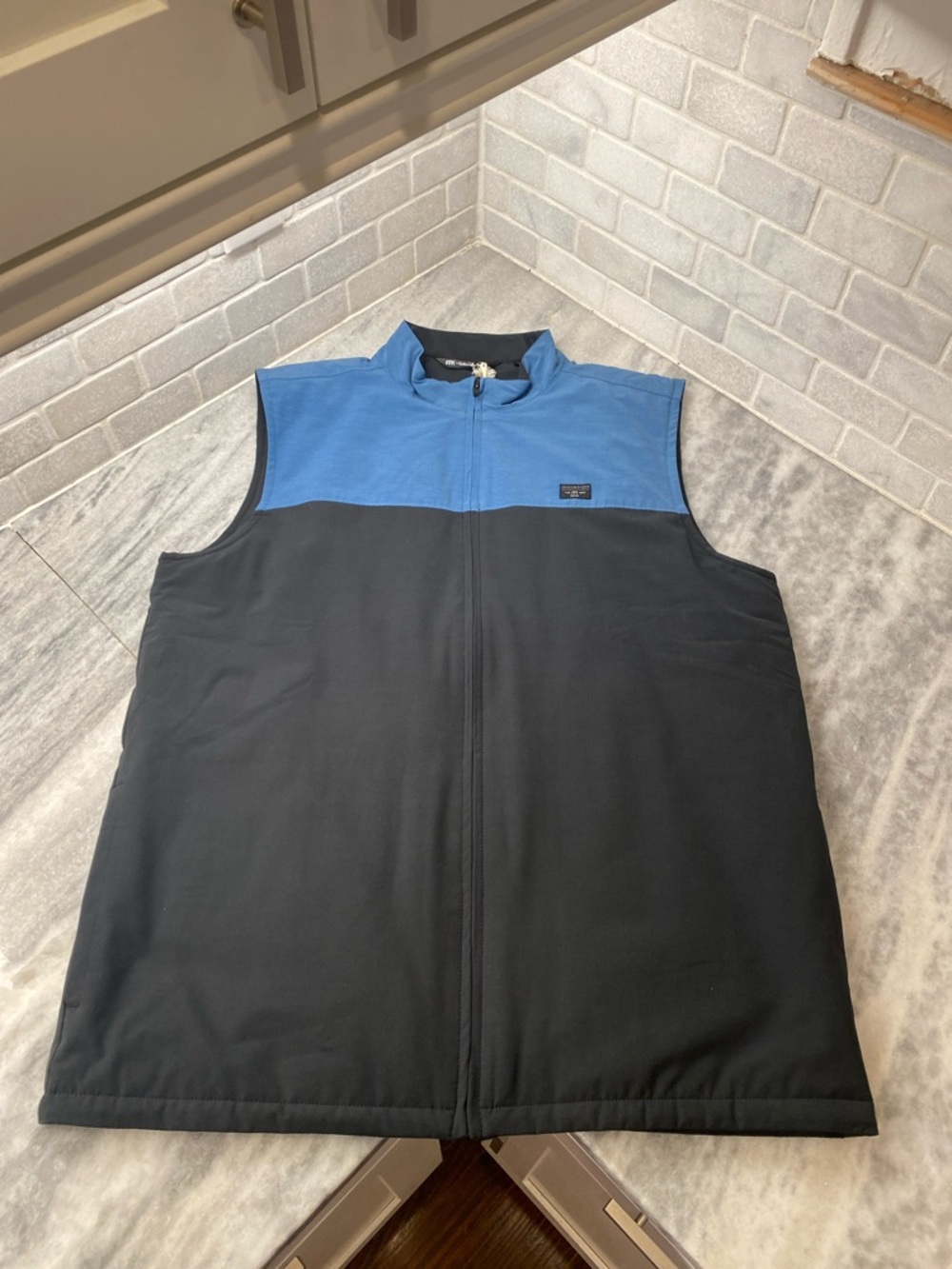 Travis Mathew Blue and Black Sleeveless Zip Vest